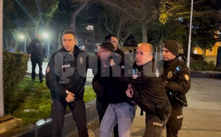 Tartıştığı gencin başında içki şişesini kırdı